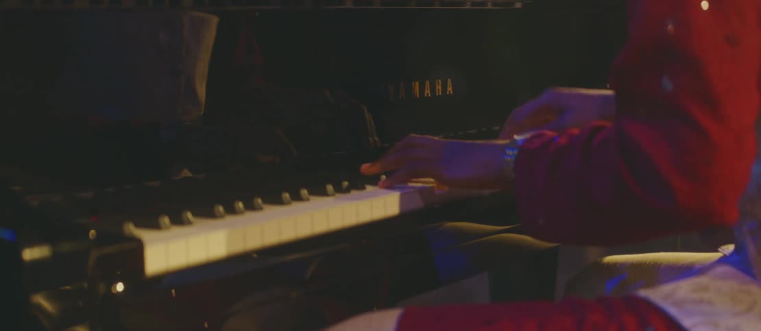Hands of a man playing the piano