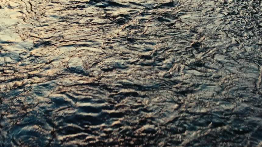 Ripples of water flowing from a river
