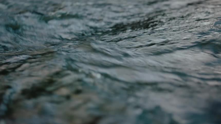 The surface of a shallow water that is moving rapidly
