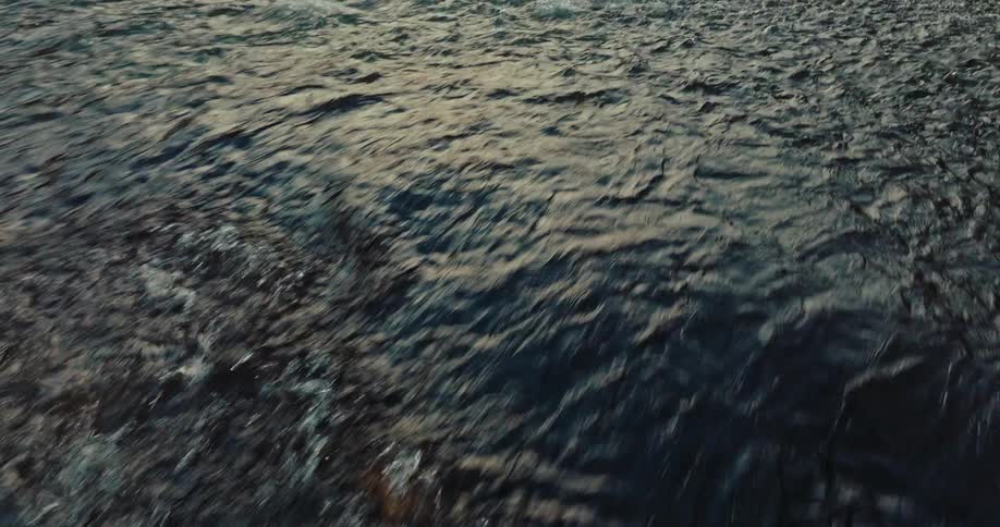 The water flows fast over the rocks