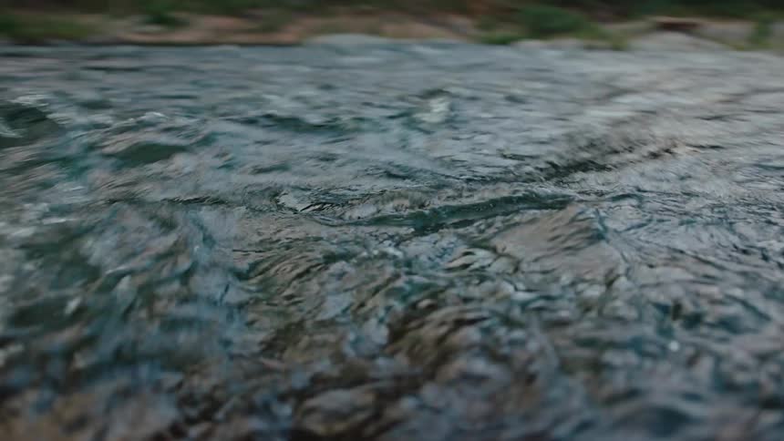 River rapids flow quickly in the afternoon