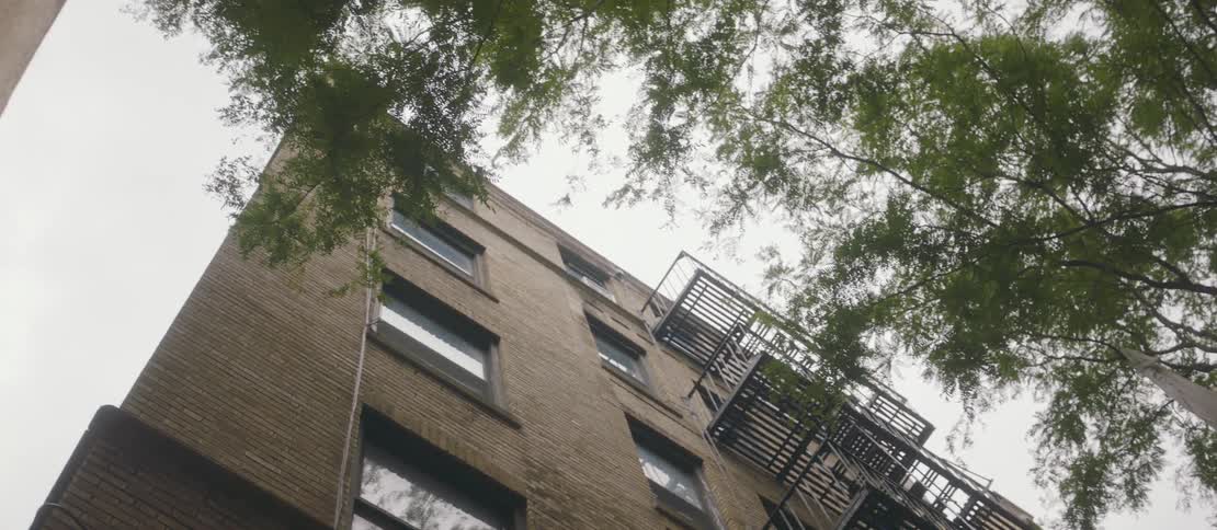 A fire escape runs up the side of the building