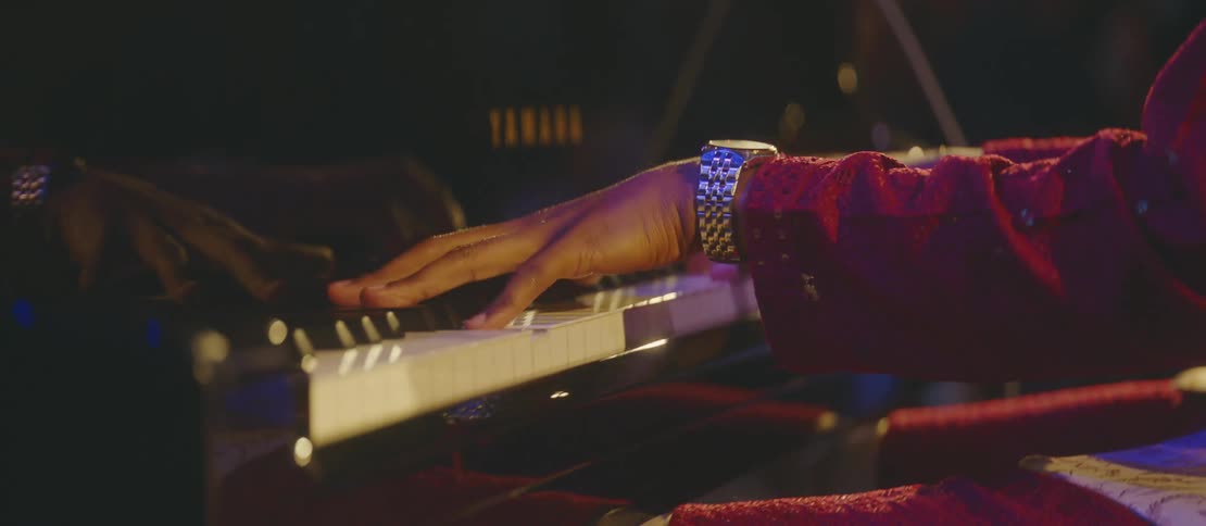 A man is playing the piano