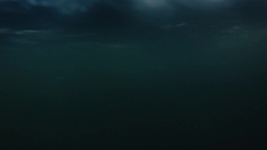 The water dark murky water is moving fast