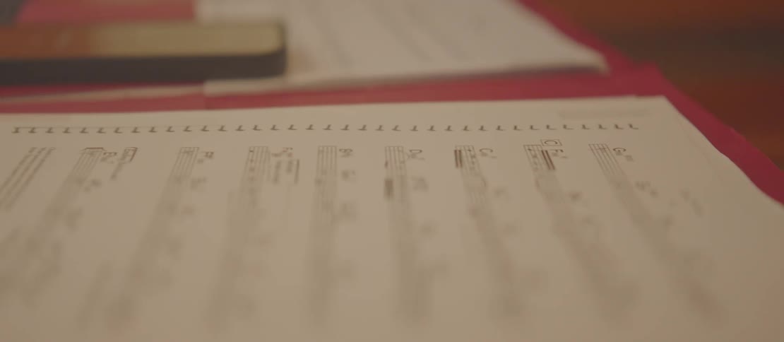 Papers with musical notes on a table