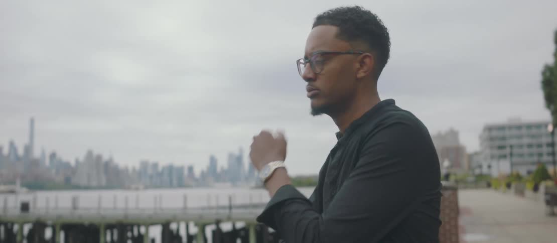 Man enjoying the view on a pier in the city