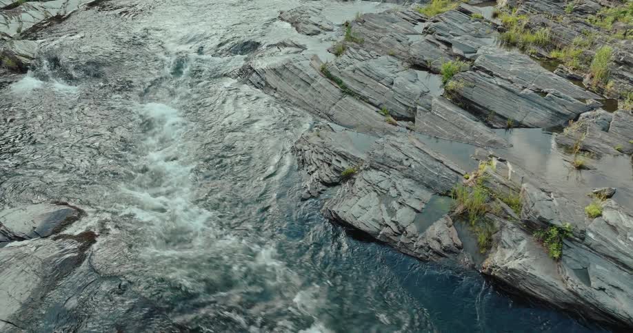 River water flowing through slate rock
