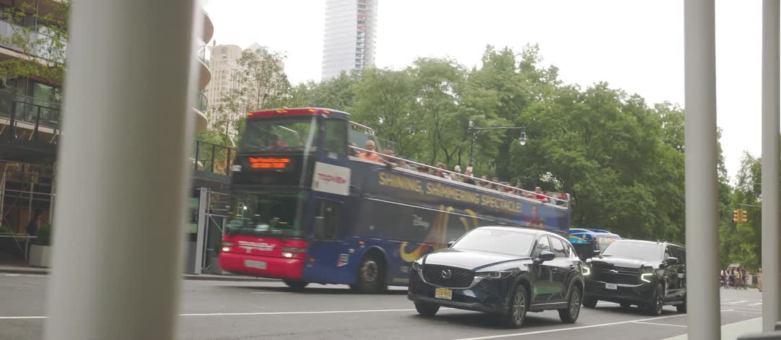 Pedestrians ride in vehicles and walk in the city