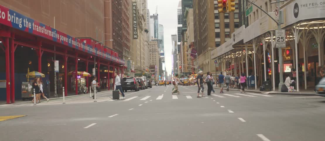 Pedestrians walking on streets of a metropolis with vehicle traffic