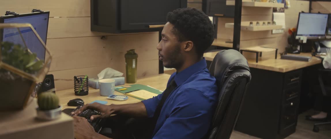 Two young people in an office environment working