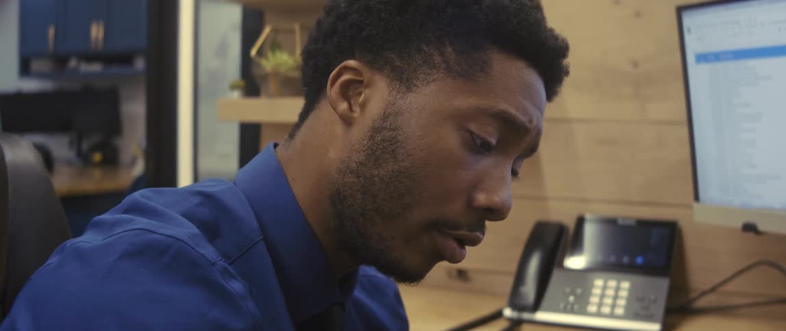 A clip of a male employee working in the office