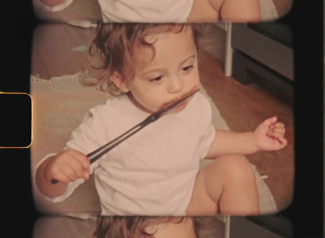 Super 8 film of a toddler scoops a spoonful of cake mix from a large baking bowl