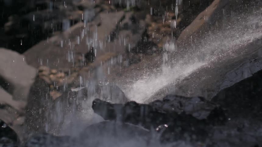 Water falling freely over rocks in a natural environment