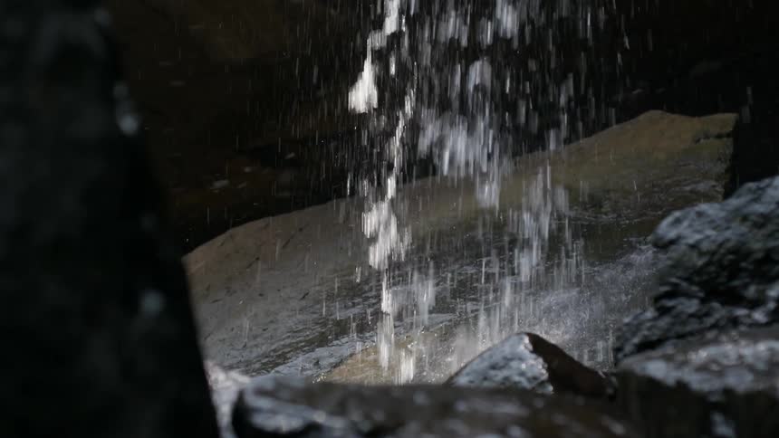 Water from a waterfall falling on rocks