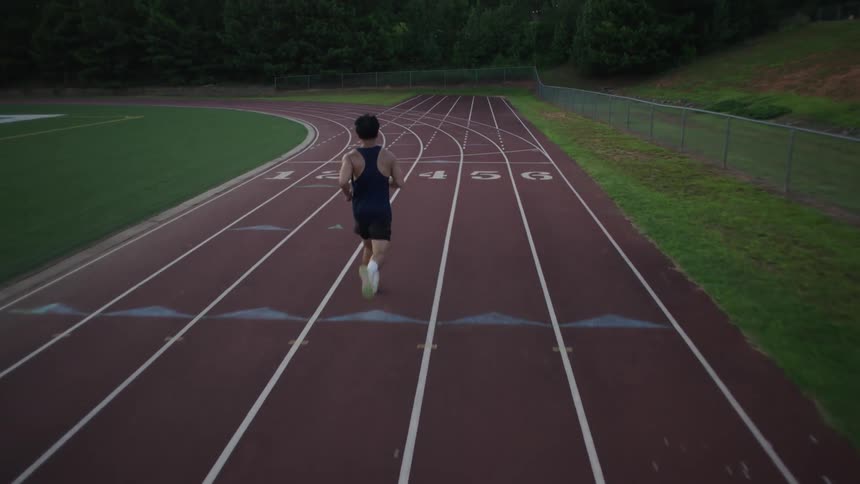 Man running on an athletics track
