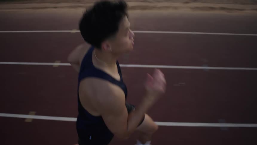 A clip of a an asian athlete running on the track
