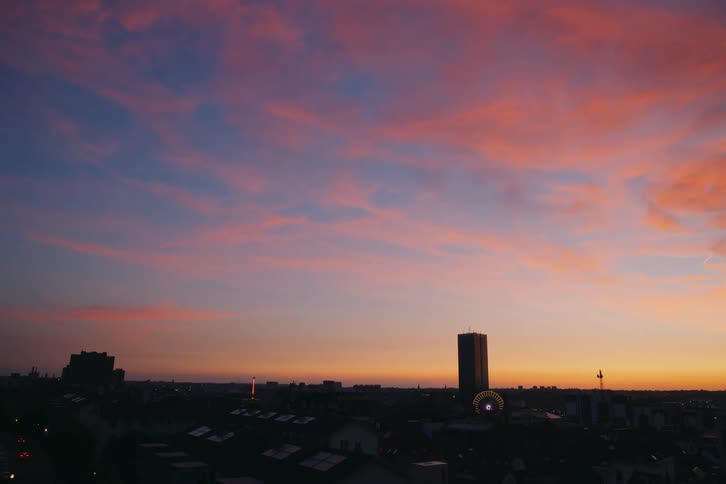 Landscape of the silhouette of a metropolis with the sky in shades of orange and blue