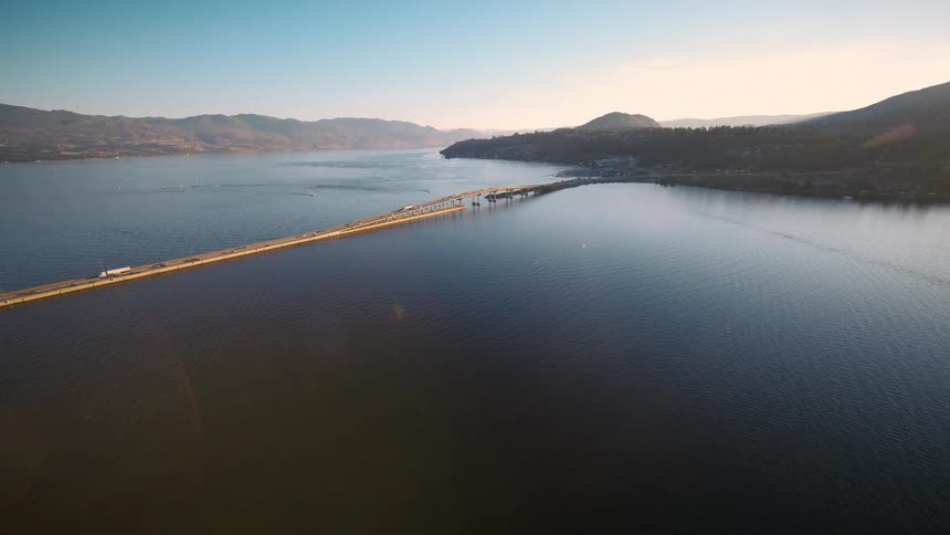 An aerial clip of a bridge across the lake