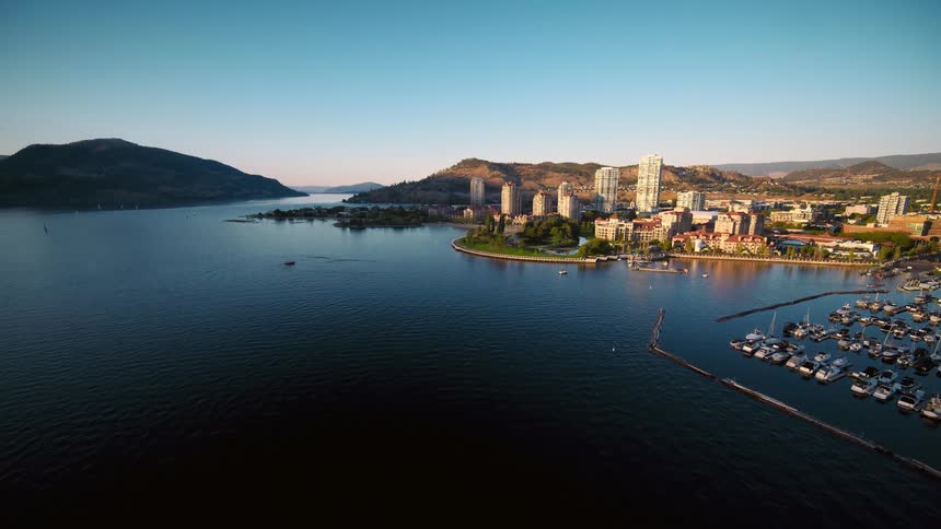 Aerial panorama of a seaside metropolis with mountains in the background