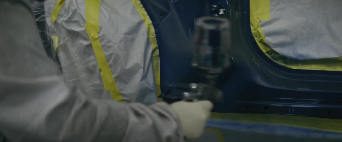 A clip of a person spraying a car