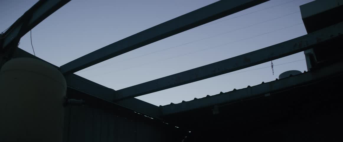 Large beams stretch across the top of building