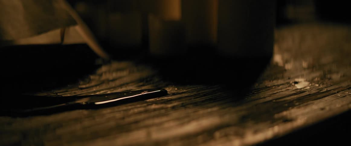 Blood puddled on a plank of wood