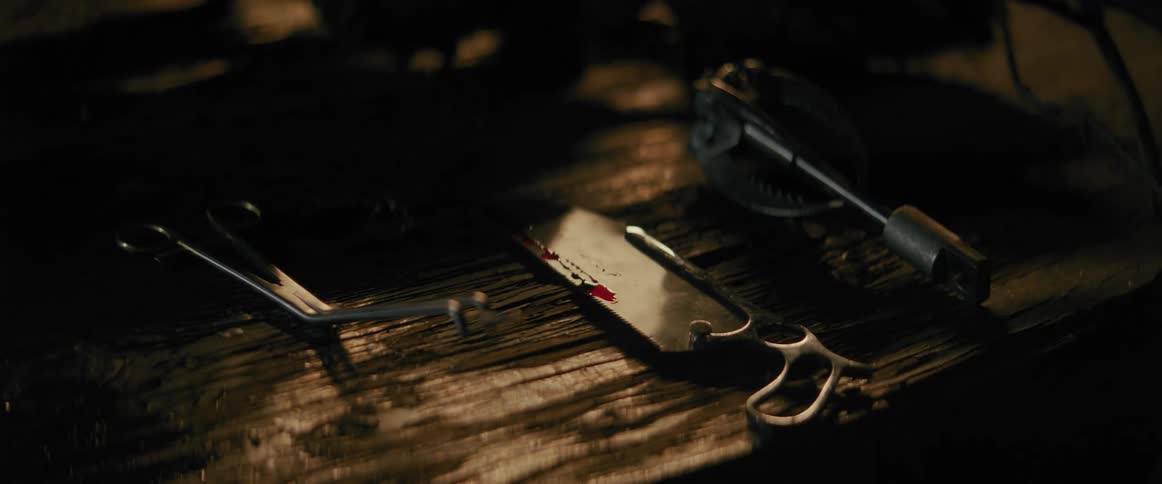 Torture devices with blood being placed on top of a table