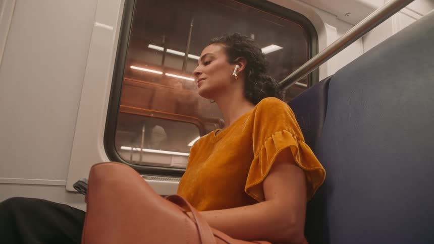 Woman sitting on a train seat