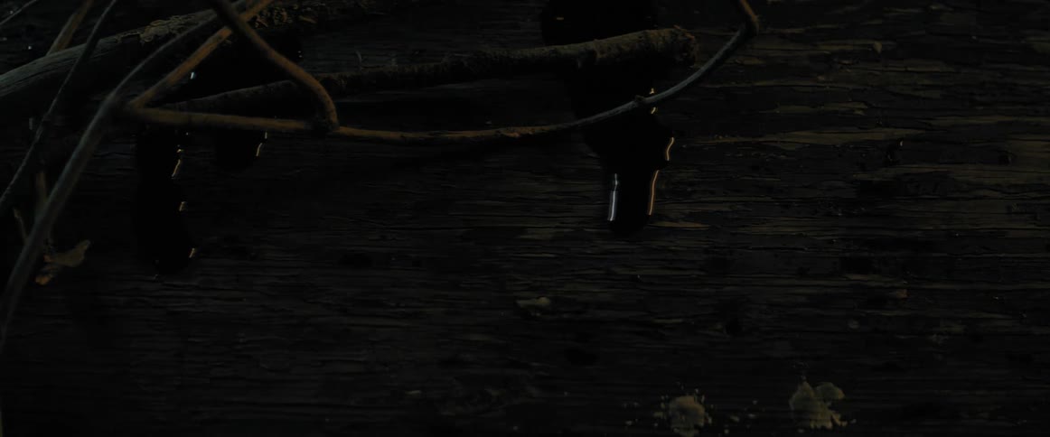 Blood oozing down a wooden table