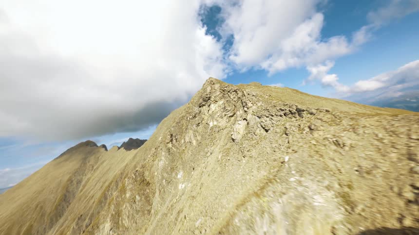 Landscape of a mountain valley with cliffs on a partly cloudy day