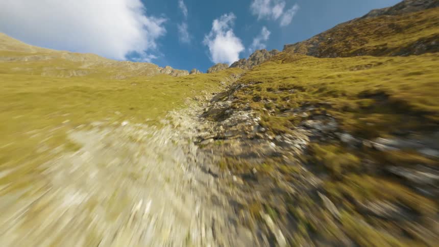 Flying Up a Green Grass-Covered Mountain with an FPV Drone