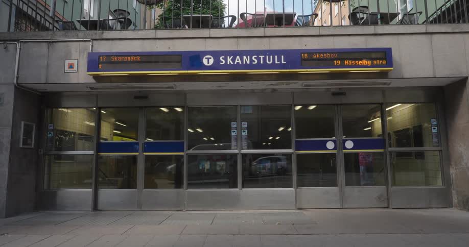 Person walks past the entrance of a transit station in skanstull