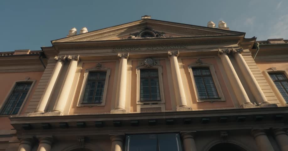 The old building has pillars in the front
