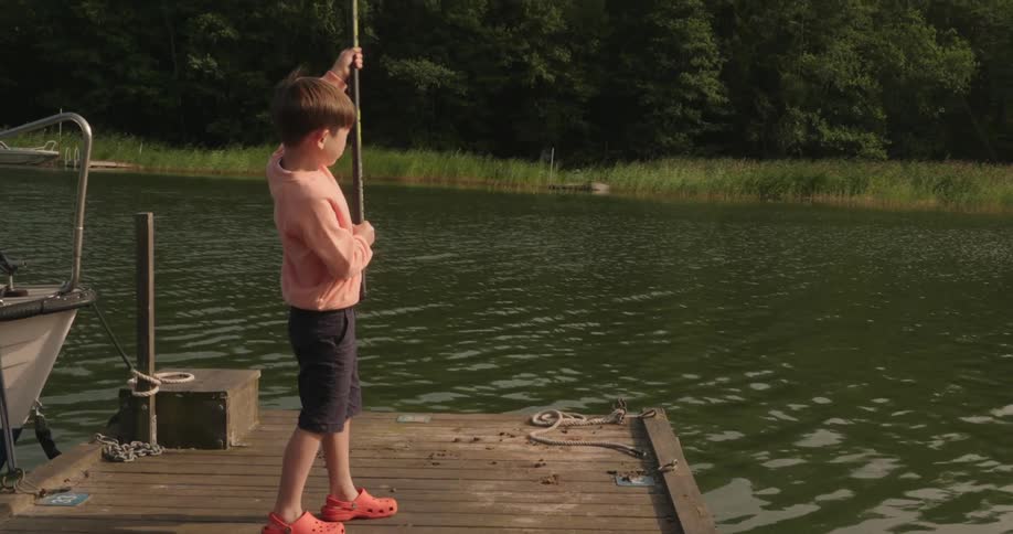 A clip of a kid fishing by the river
