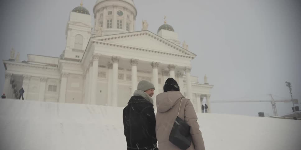 A clip of two couples walking in the snow