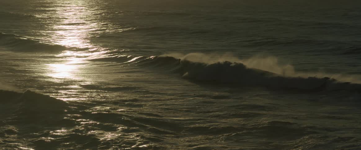 Seascape with waves and reflection of sunlight