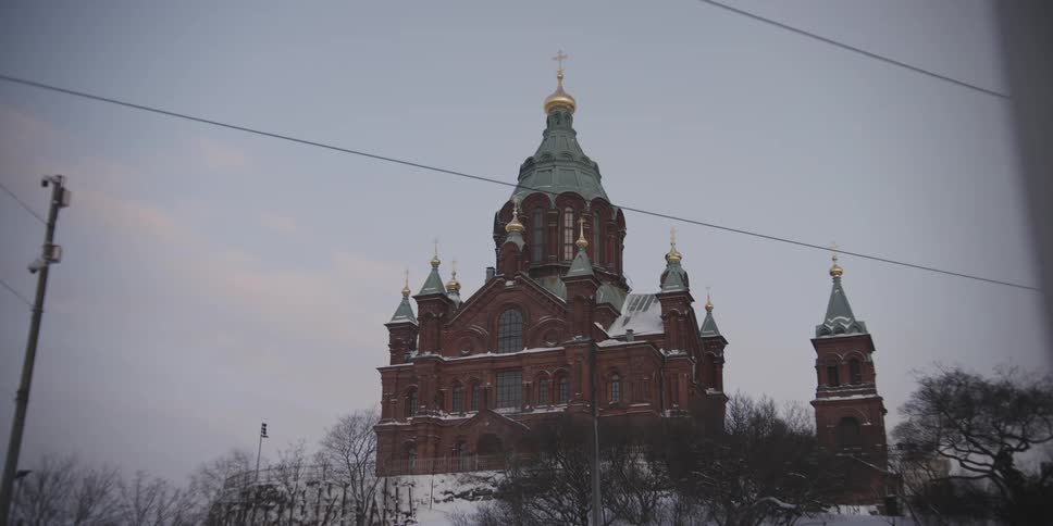 A large church has a cross at the top