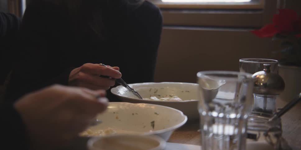 Couple eating soups in a romantic way serving each other