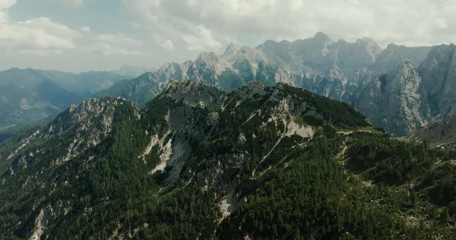 Aerial panorama of a mountain valley with vegetation on a cloudy day