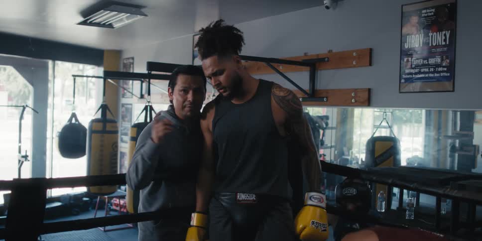 A coach talks to a boxer in his corner