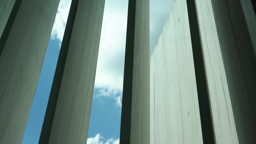 Blinds open to reveal a blue sky