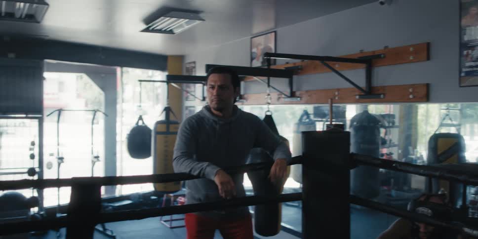 A boxer exits his corner of the ring