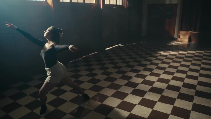 Woman alone in a room dancing