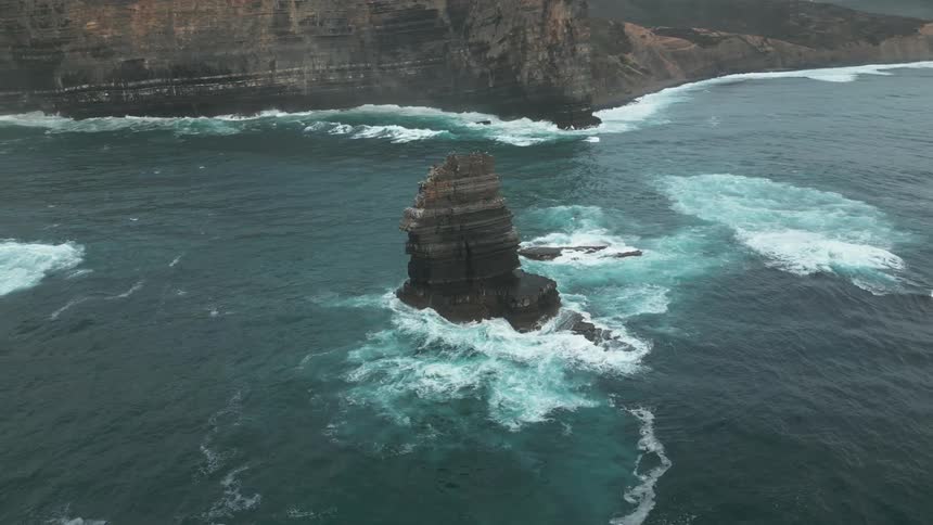 Rocky cliff in the middle of the ocean on a peninsula