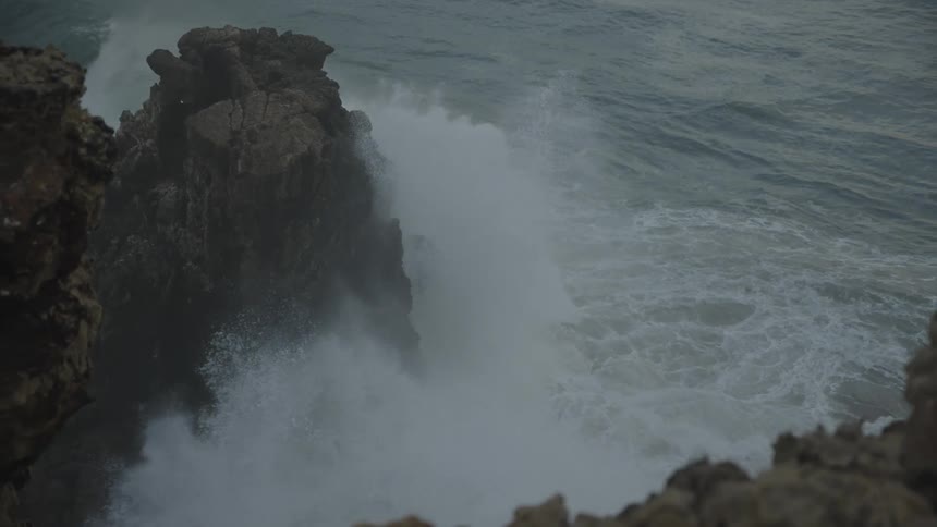A rocky coastline with waves crashing against the rocks
