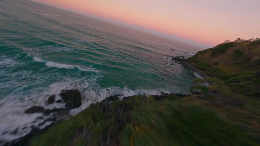 Aerial view of a coastal landscape during sunset