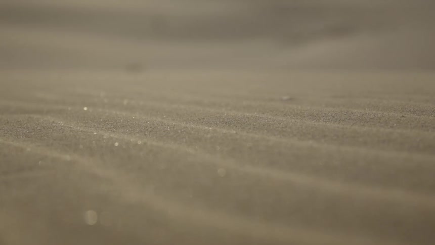 Close up of sand with sun reflection