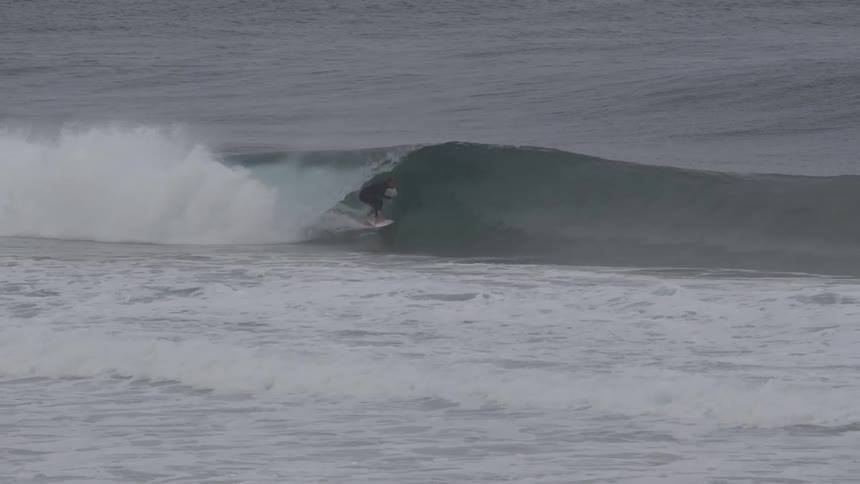 Men are surfing in the ocean