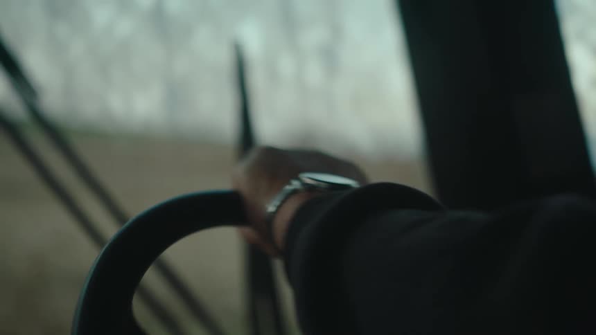 Hand of a person driving an agricultural machine