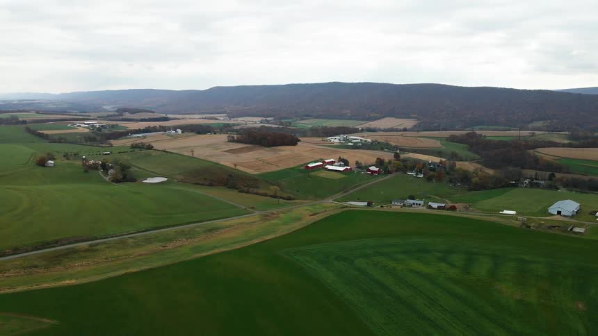 Aerial of a farming community on a mostly cloudy day